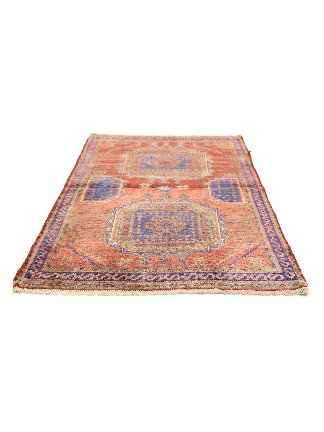 Hand-knotted red rug from the Middle East with a unique patina finish