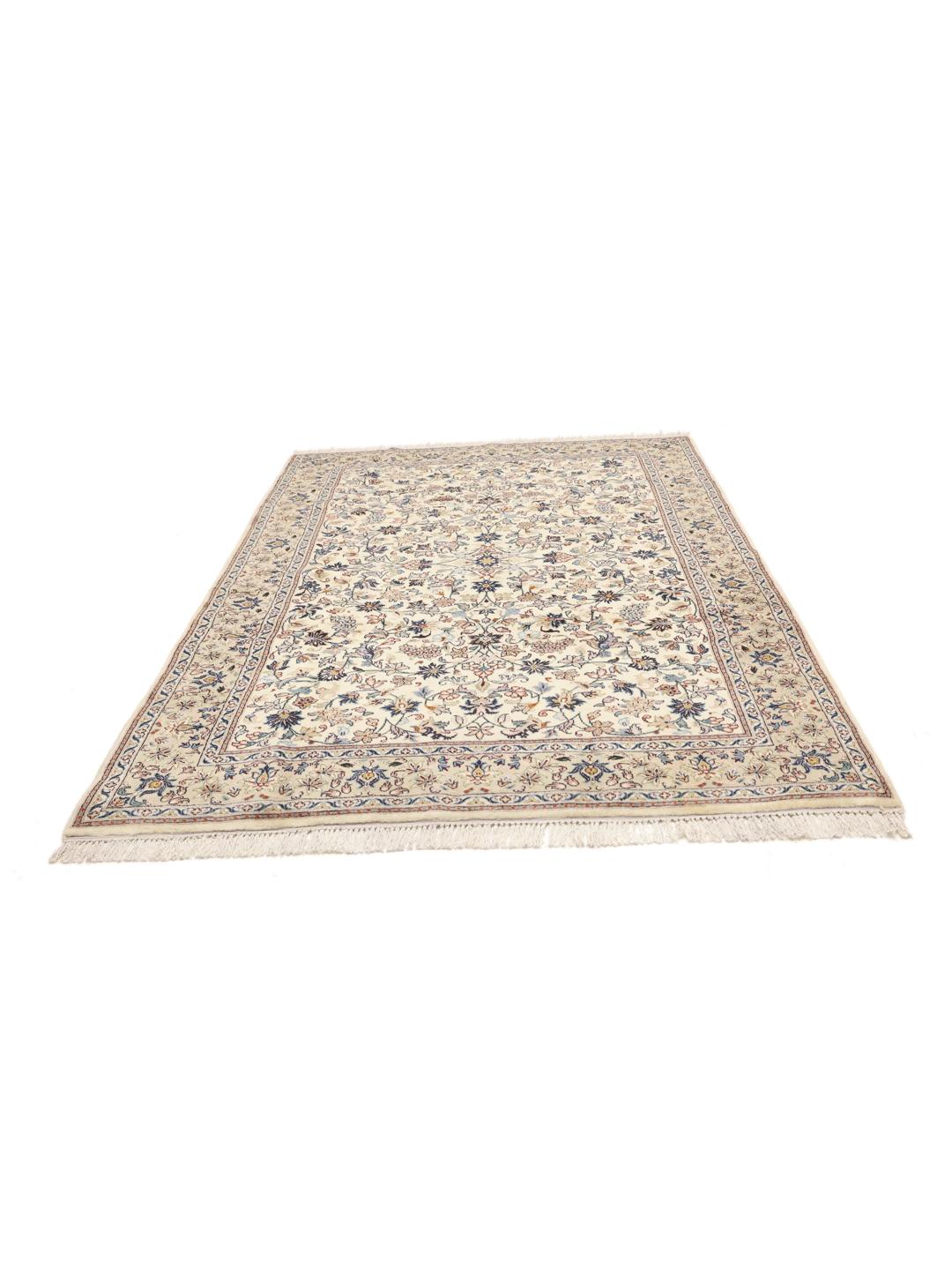 A hand-knotted Keshan rug from the Middle East with a beige field and floral patterns.