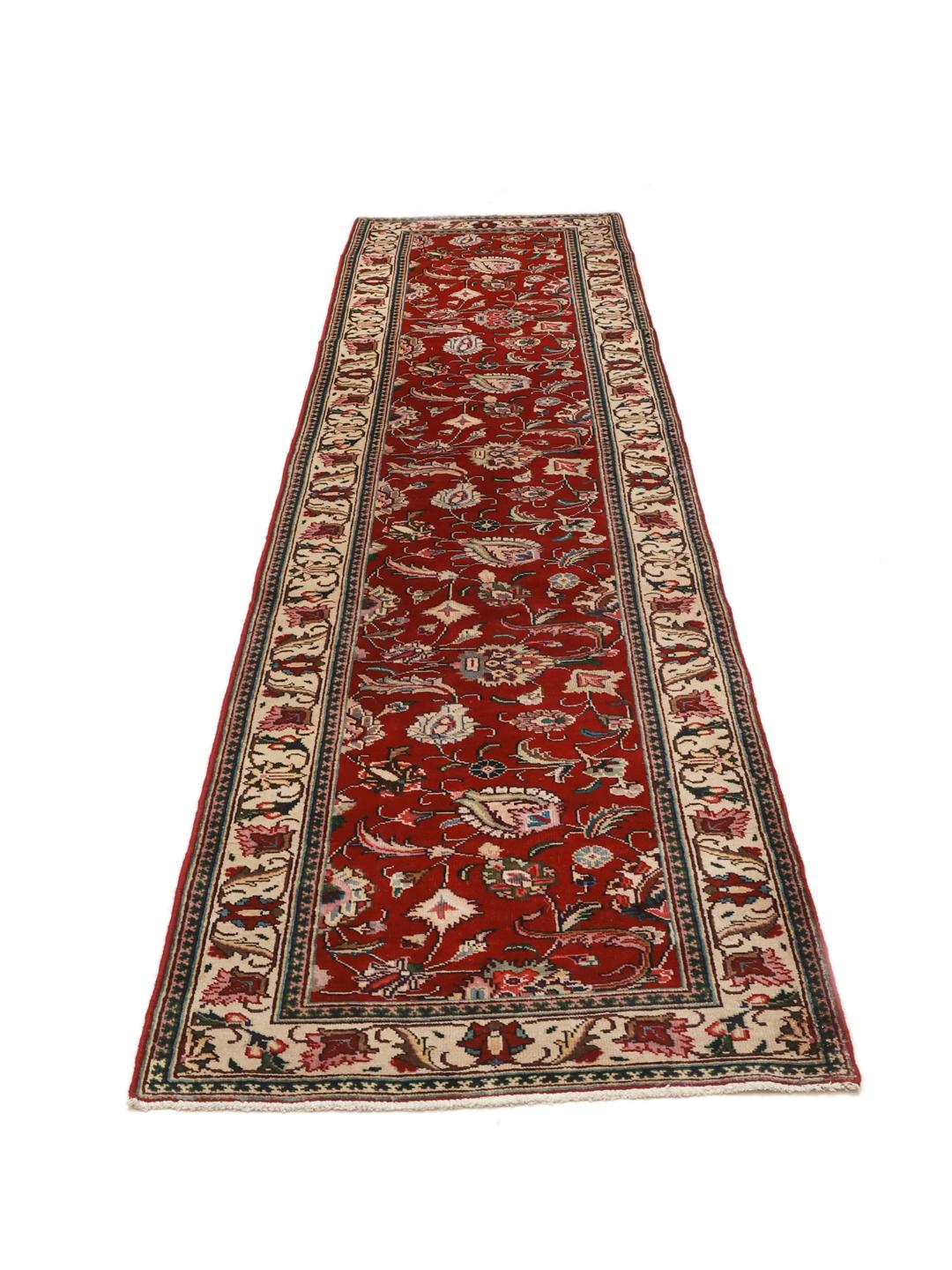 Hand-knotted Tabriz runner from the Middle East in deep red and beige tones.