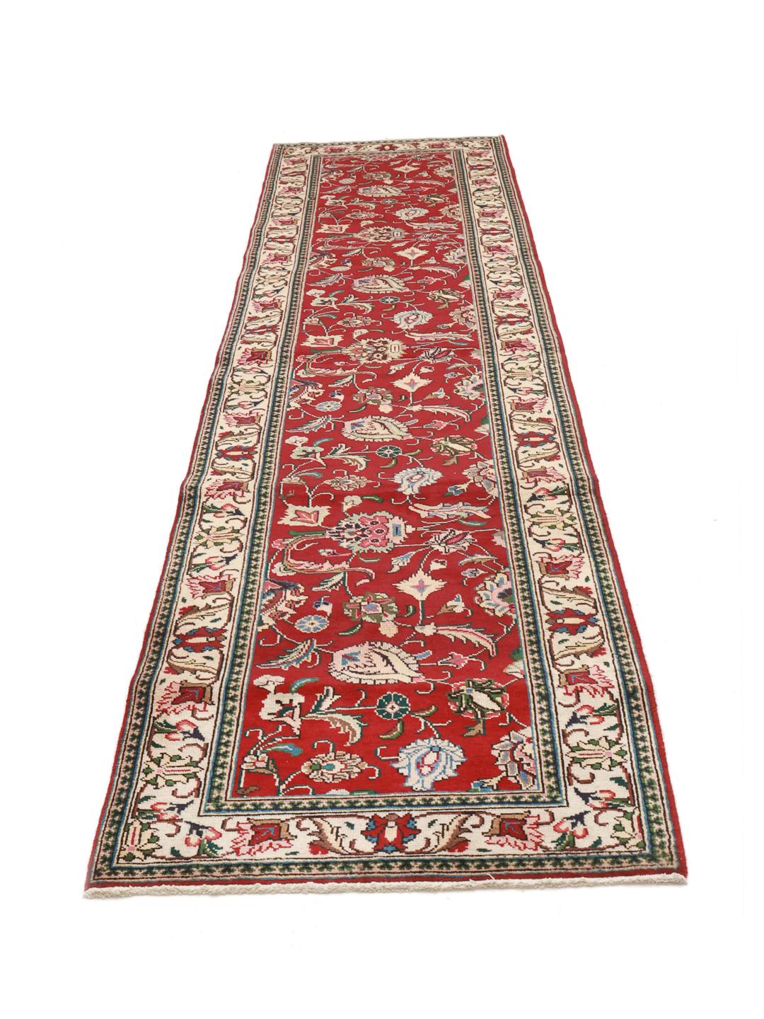 Hand-knotted Tabriz runner from the Middle East in deep red and beige tones.