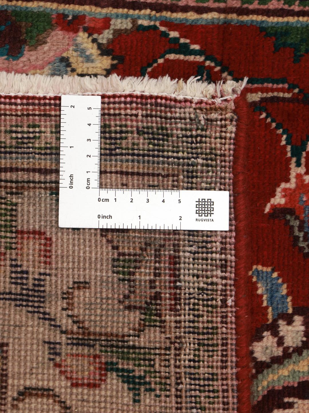 Hand-knotted Tabriz runner from the Middle East in deep red and beige tones.
