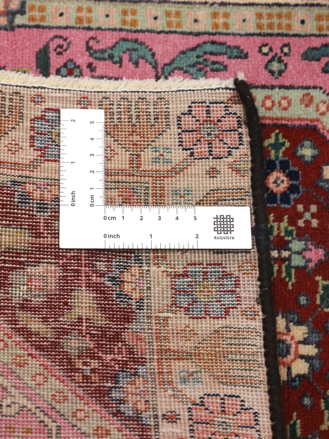Hand-knotted Tabriz rug with a red and pink medallion design from the Middle East