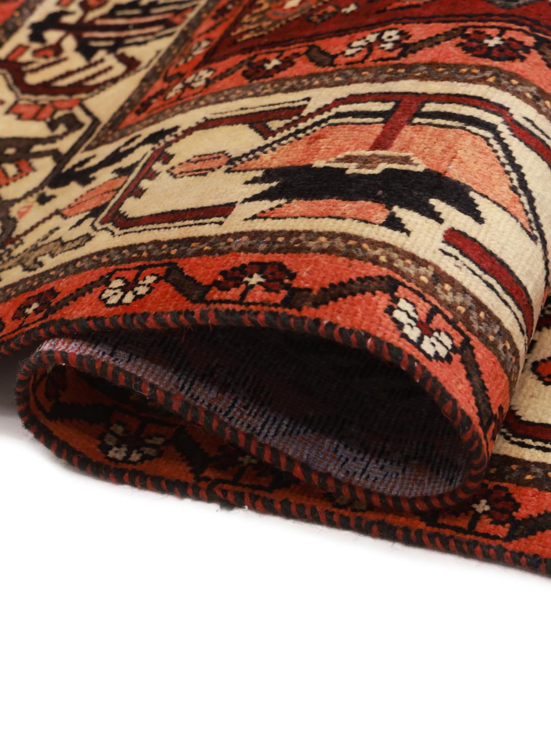 Hand-knotted Hamadan rug from the Middle East in dark red and black with geometric medallion patterns