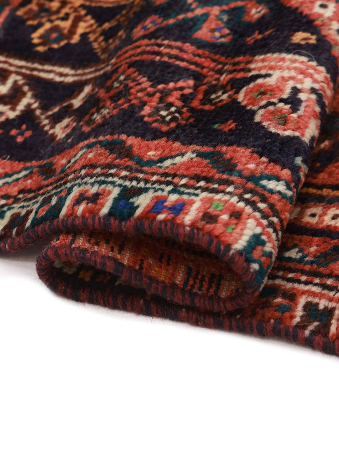 Hand-knotted Shiraz rug from the Middle East in dark-red and blue tones