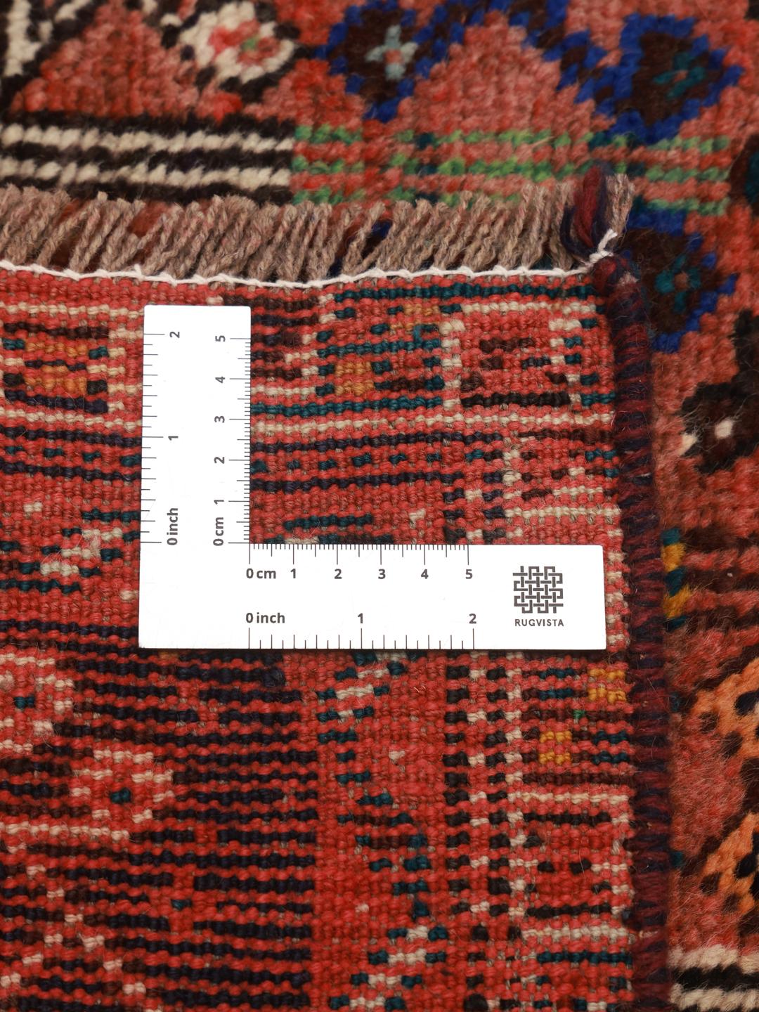 Hand-knotted Shiraz rug from the Middle East in dark-red and blue tones