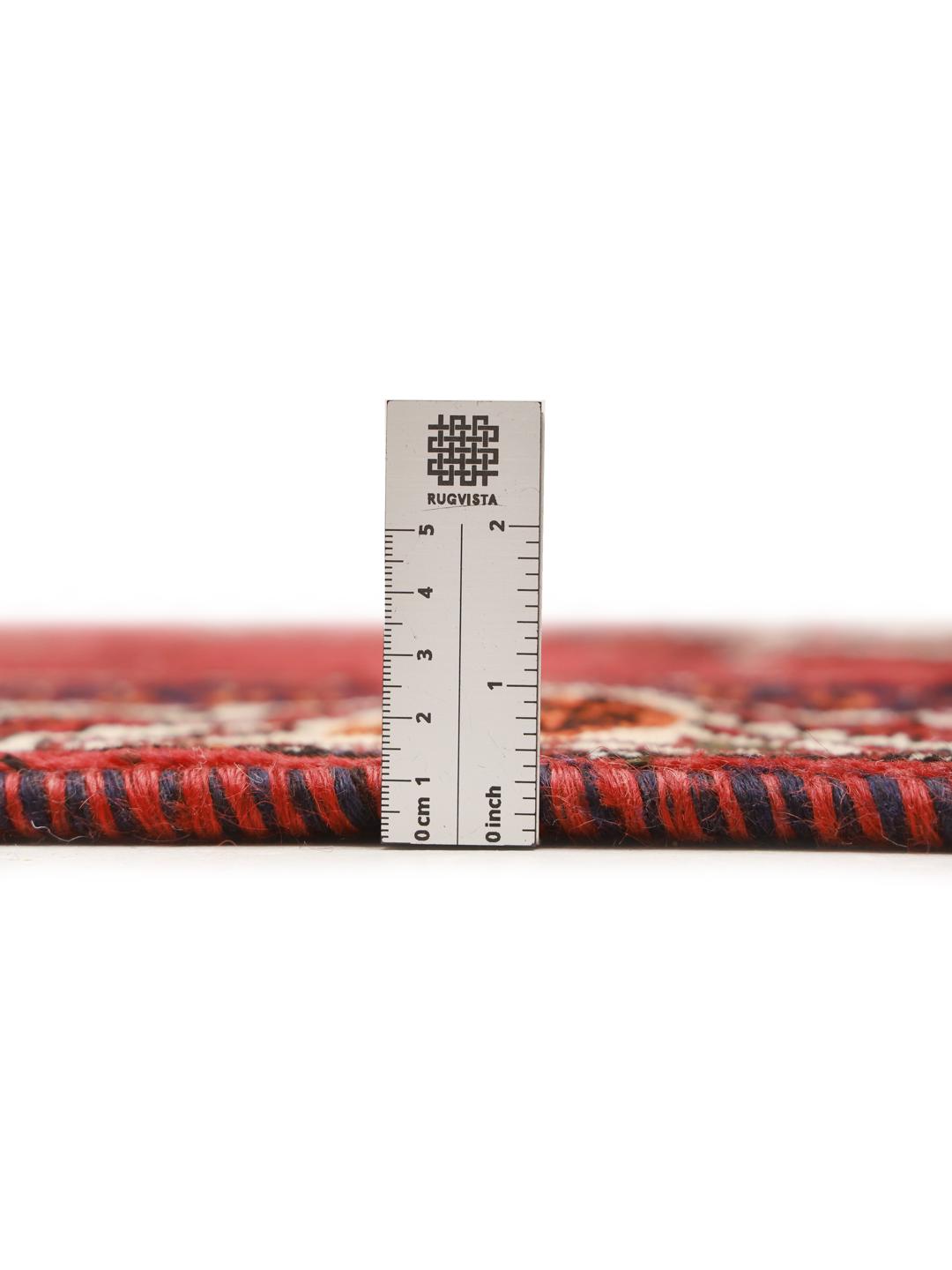 Hand-knotted Ghashghai rug with red and blue tribal patterns from the Middle East
