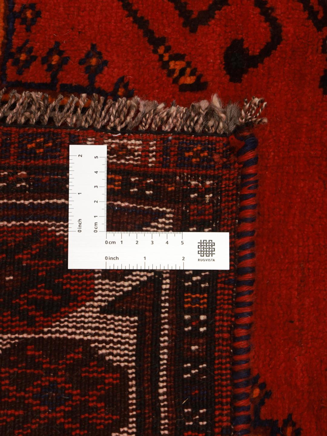 Hand-knotted Ghashghai rug with red and blue tribal patterns from the Middle East