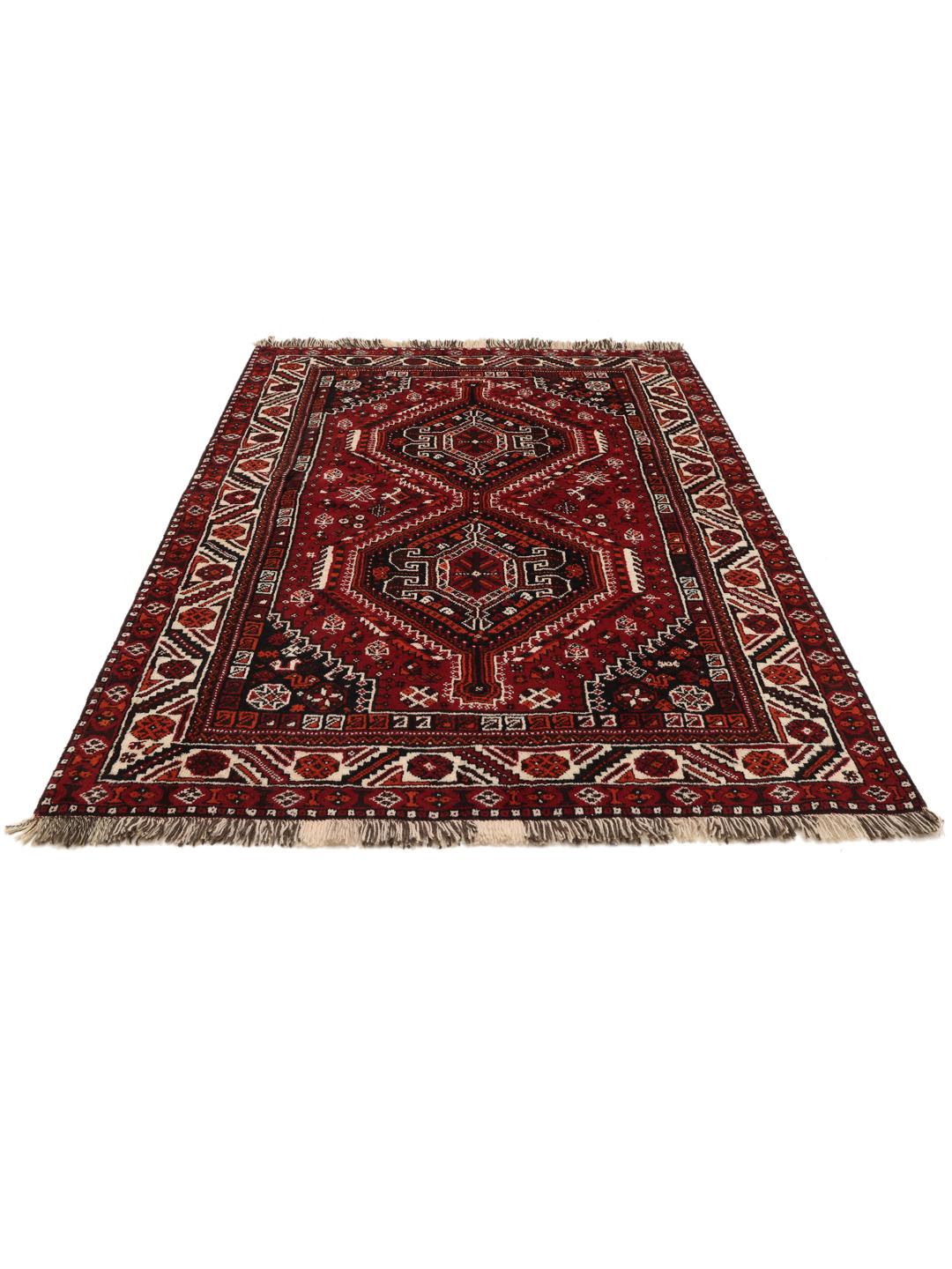 Hand-knotted Middle Eastern rug in dark-red with geometric medallion patterns