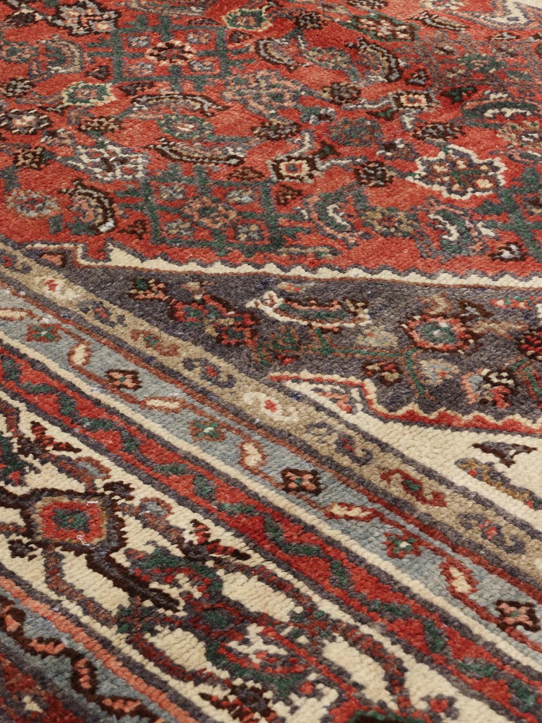 Hand-knotted Hamadan rug from the Middle East in dark-red and charcoal tones.