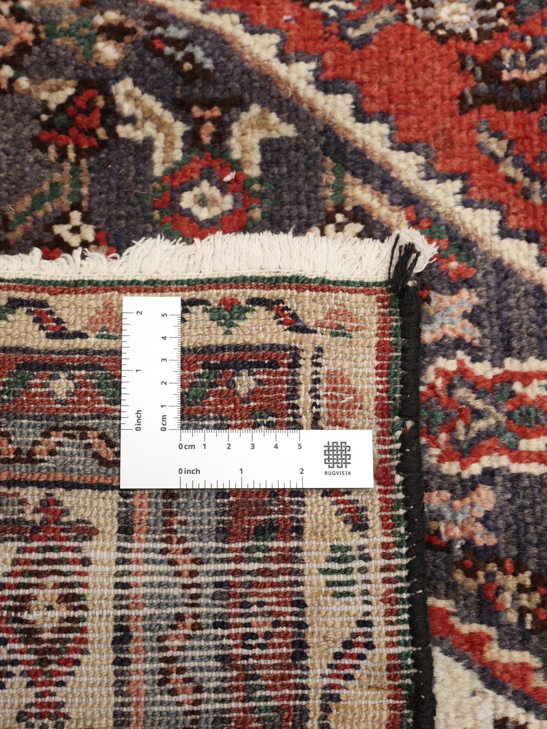 Hand-knotted Hamadan rug from the Middle East in dark-red and charcoal tones.
