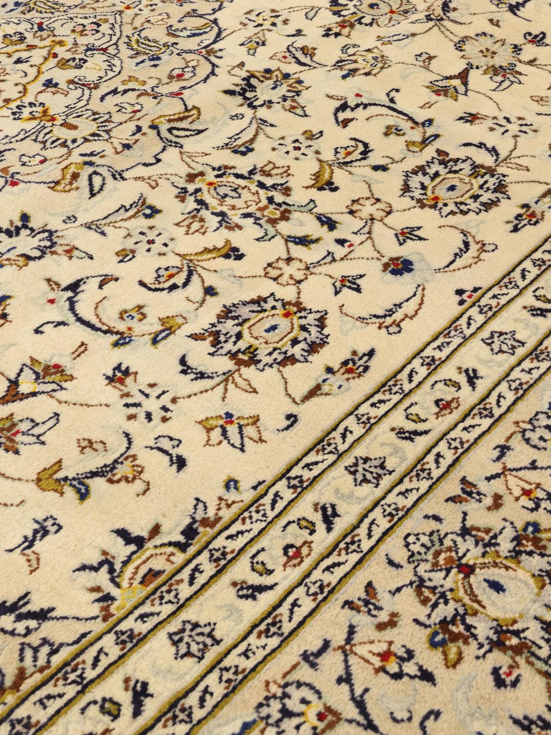 Hand-knotted Keshan rug from the Middle East in a beige colour palette.