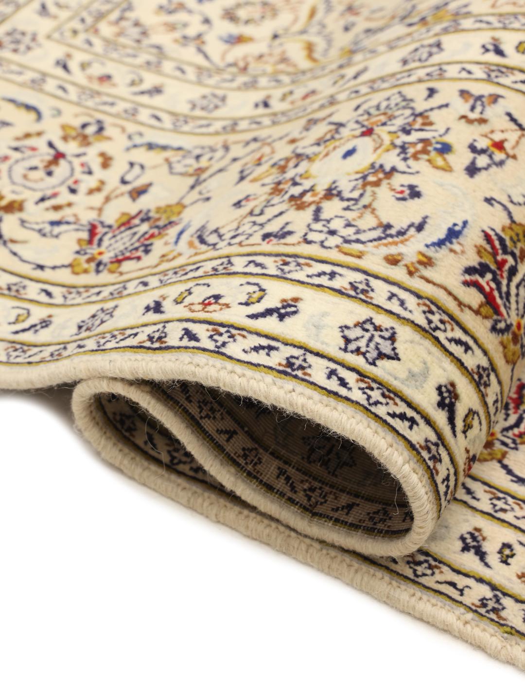 Hand-knotted Keshan rug from the Middle East in a beige colour palette.