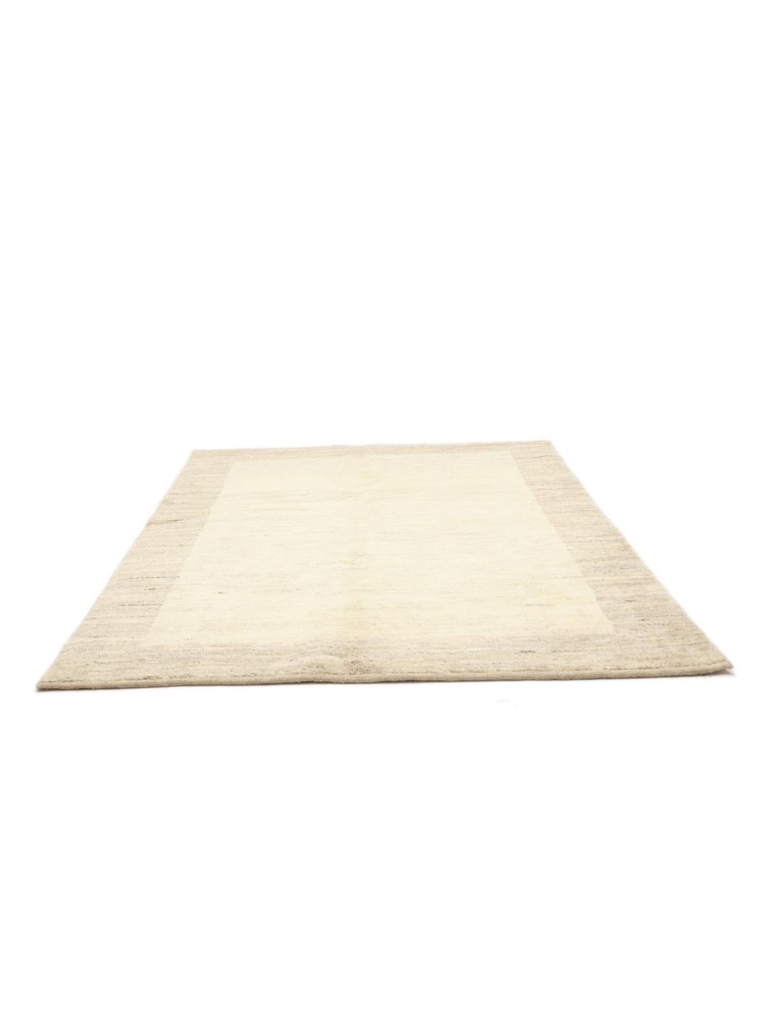 Hand-knotted wool Gabbeh rug from the Middle East in beige tones