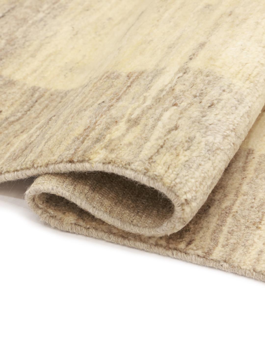 Hand-knotted wool Gabbeh rug from the Middle East in beige tones