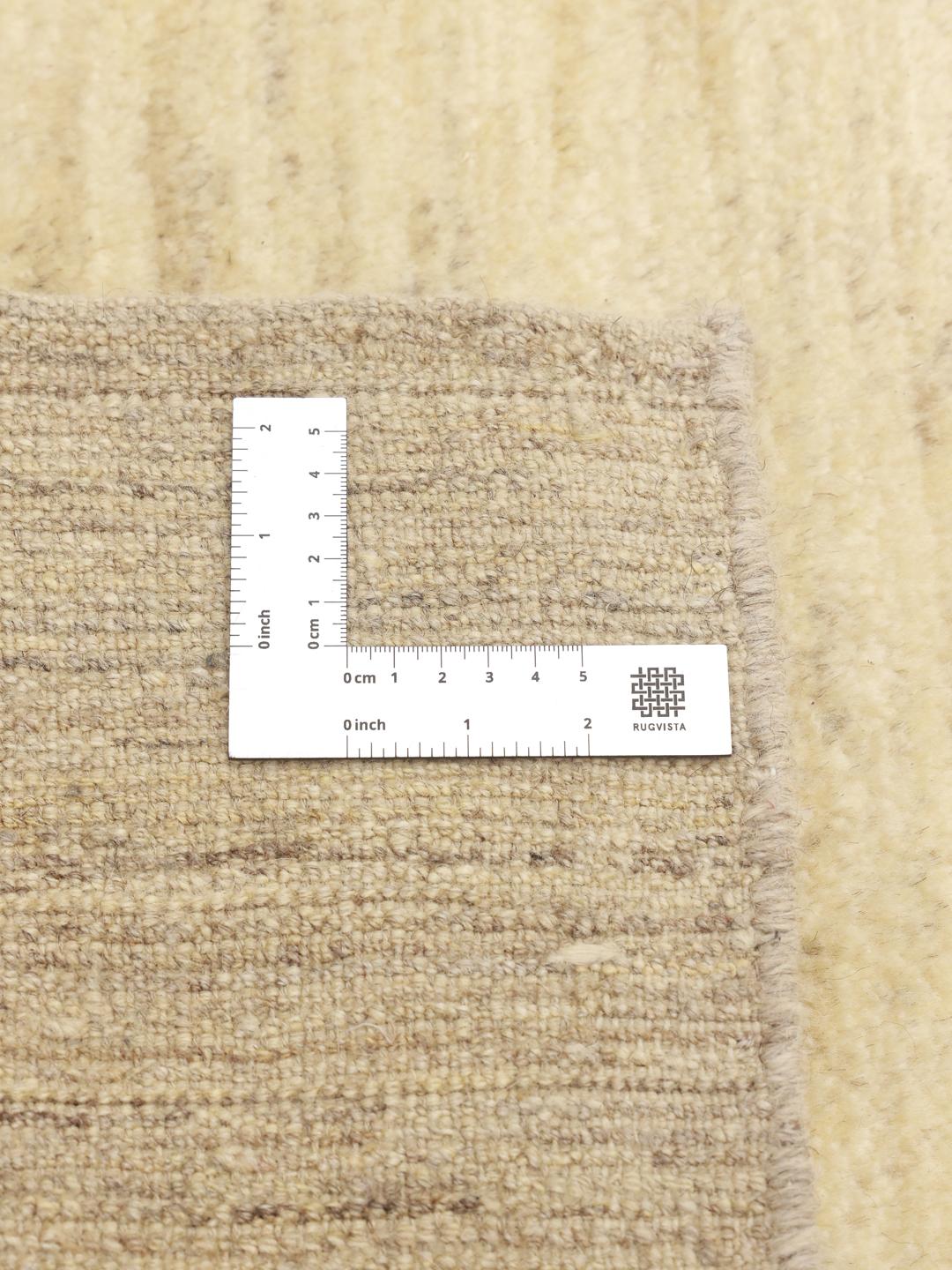 Hand-knotted wool Gabbeh rug from the Middle East in beige tones