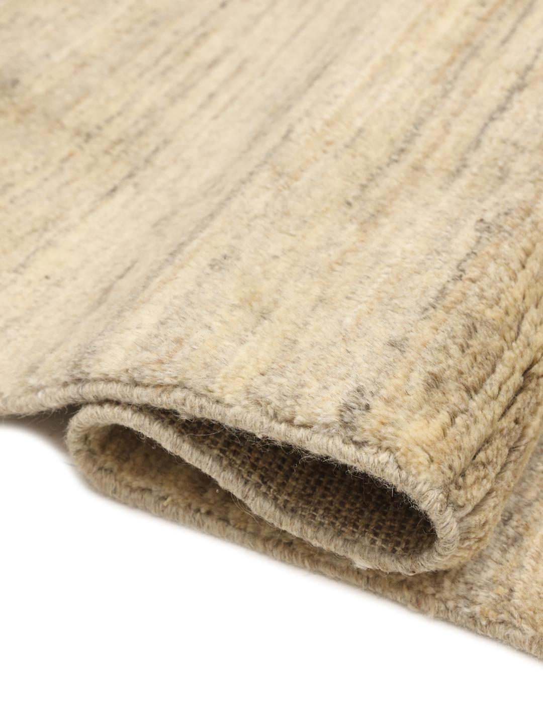 Hand-knotted beige Shabargan rug from the Middle East