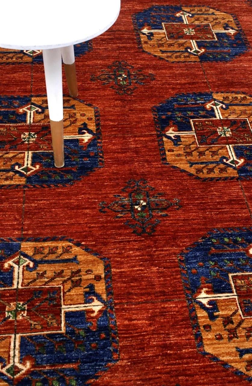 Hand-knotted Middle Eastern Kunduz rug in red with geometric motifs