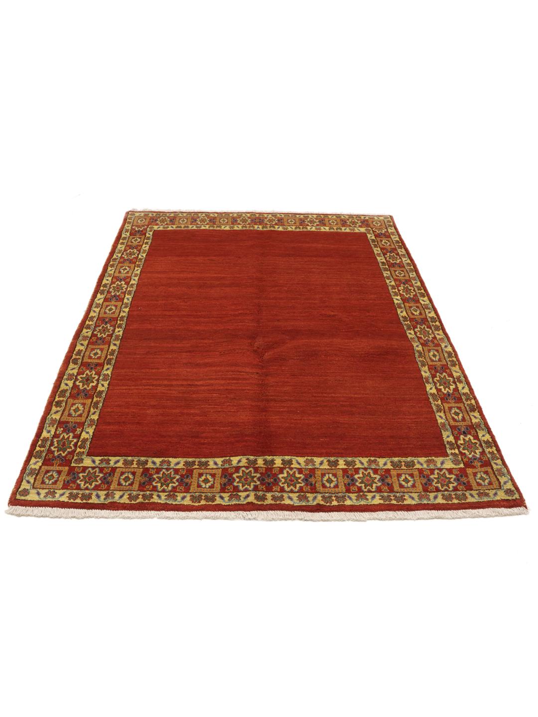 A hand-knotted Gabbeh Wool rug from the Middle East featuring a vibrant red field and geometric borders.