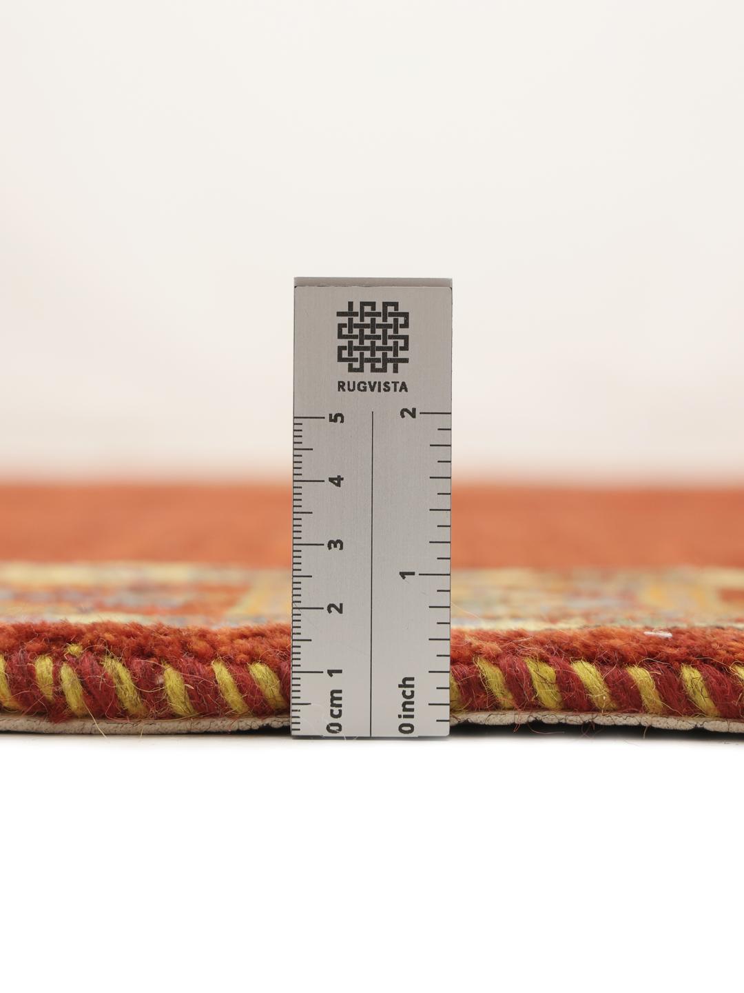 A hand-knotted Gabbeh Wool rug from the Middle East featuring a vibrant red field and geometric borders.