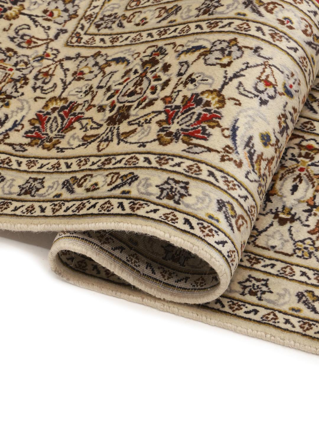 Hand-knotted Keshan rug from the Middle East with a beige field and intricate floral pattern