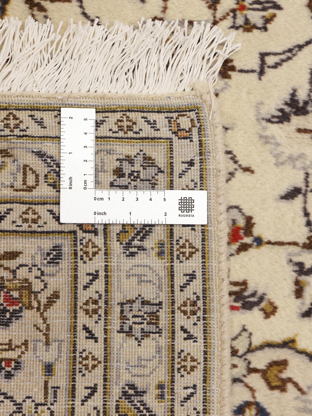 Hand-knotted Keshan rug from the Middle East with a beige field and intricate floral pattern