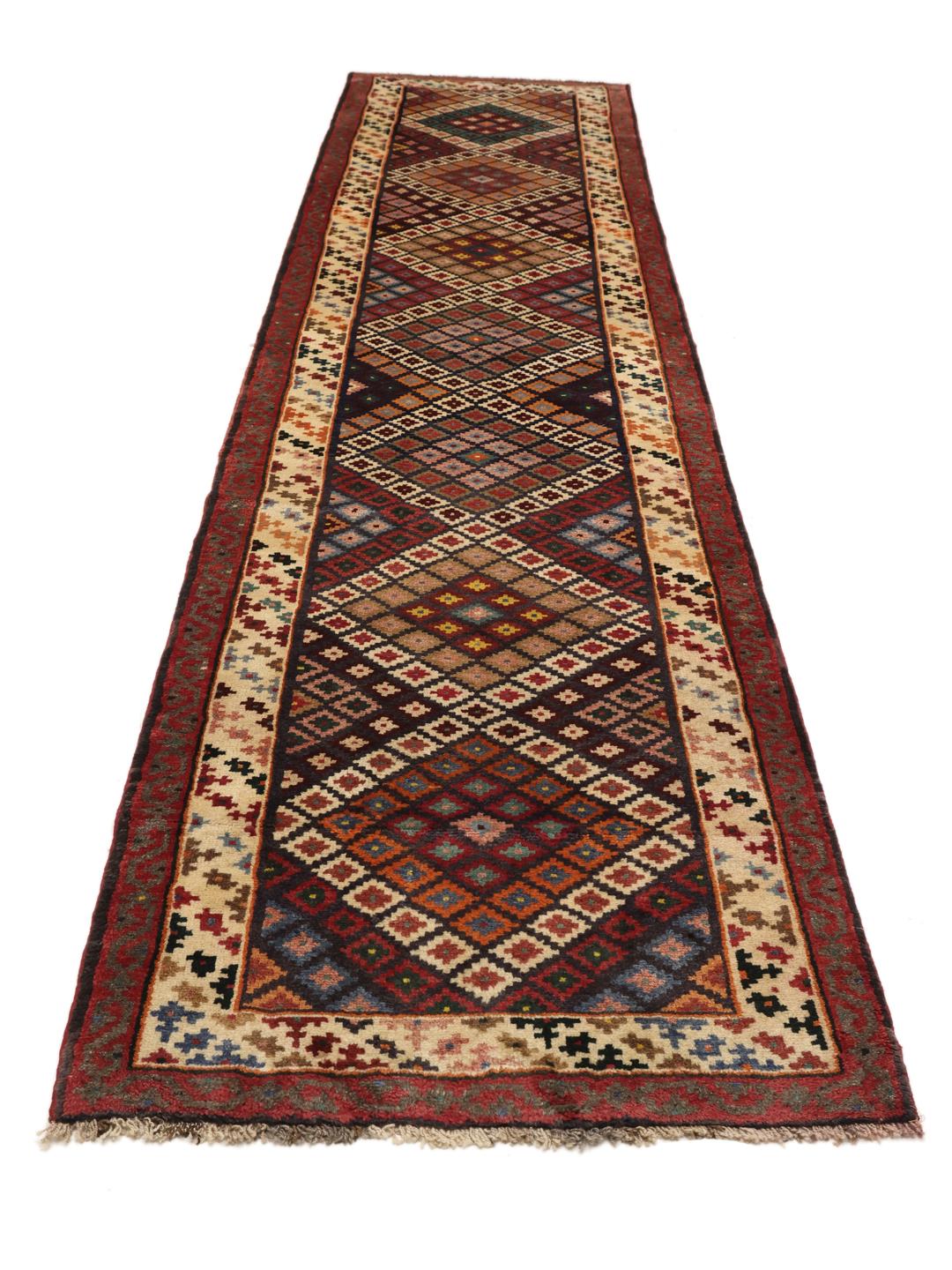 A hand-knotted Hamadan runner with a vibrant geometric pattern in multicolor wool.
