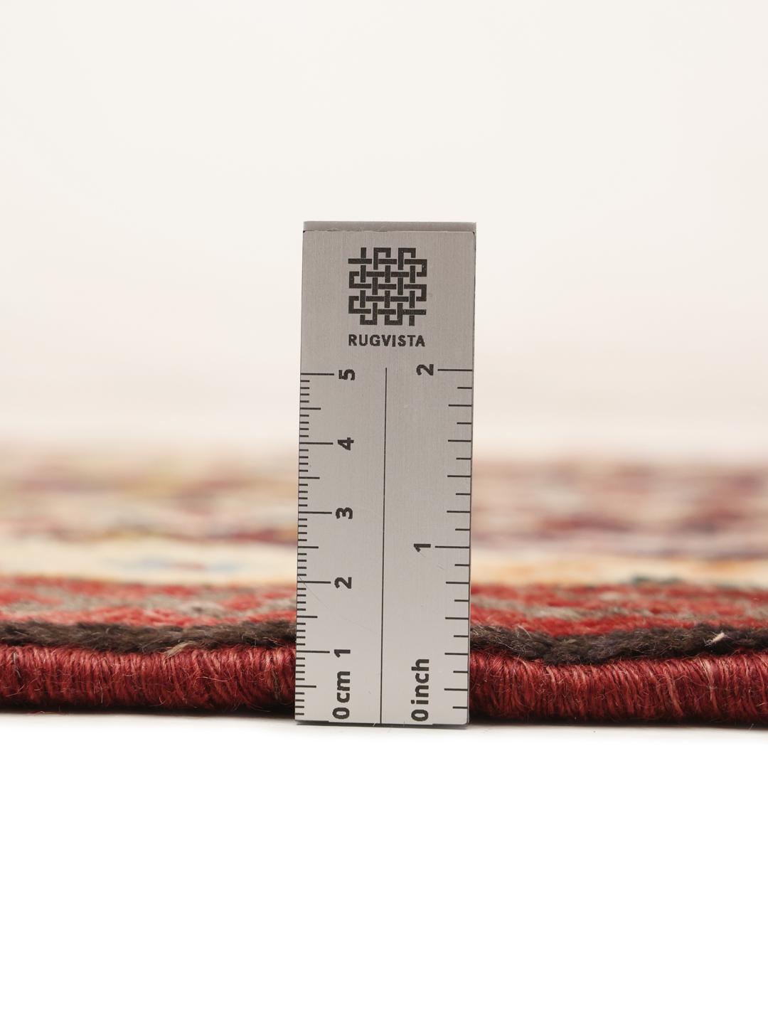 A hand-knotted Hamadan runner with a vibrant geometric pattern in multicolor wool.