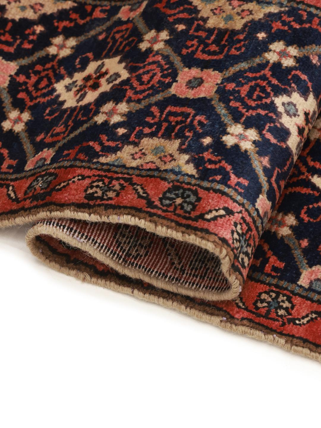 A rectangular handmade Koliai rug from the Middle East in multicolor wool.