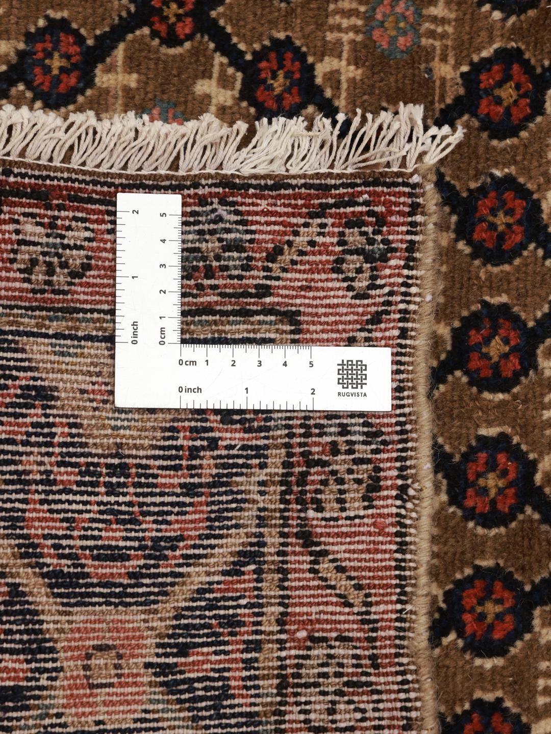 A rectangular handmade Koliai rug from the Middle East in multicolor wool.