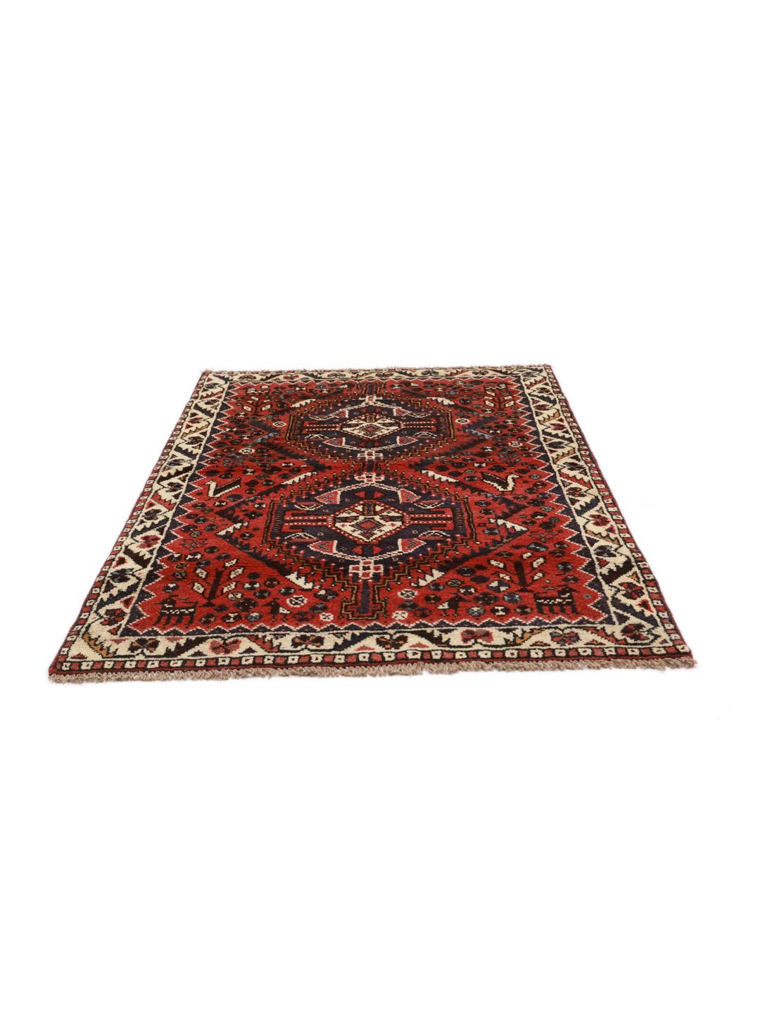 Hand-knotted Shiraz rug from the Middle East featuring a vibrant red field and geometric patterns.