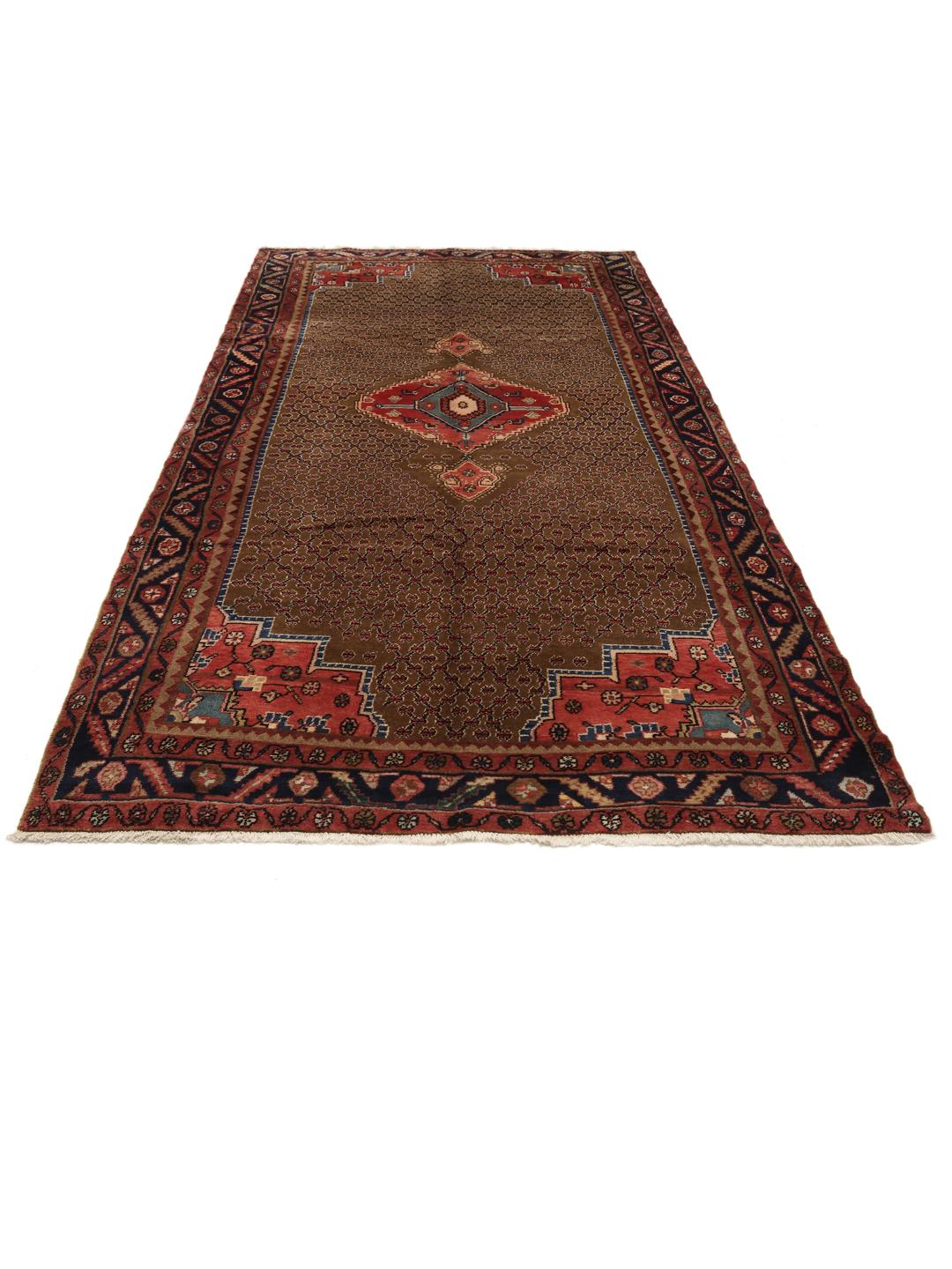 Koliai rug from the Middle East with a brown field and geometric medallion