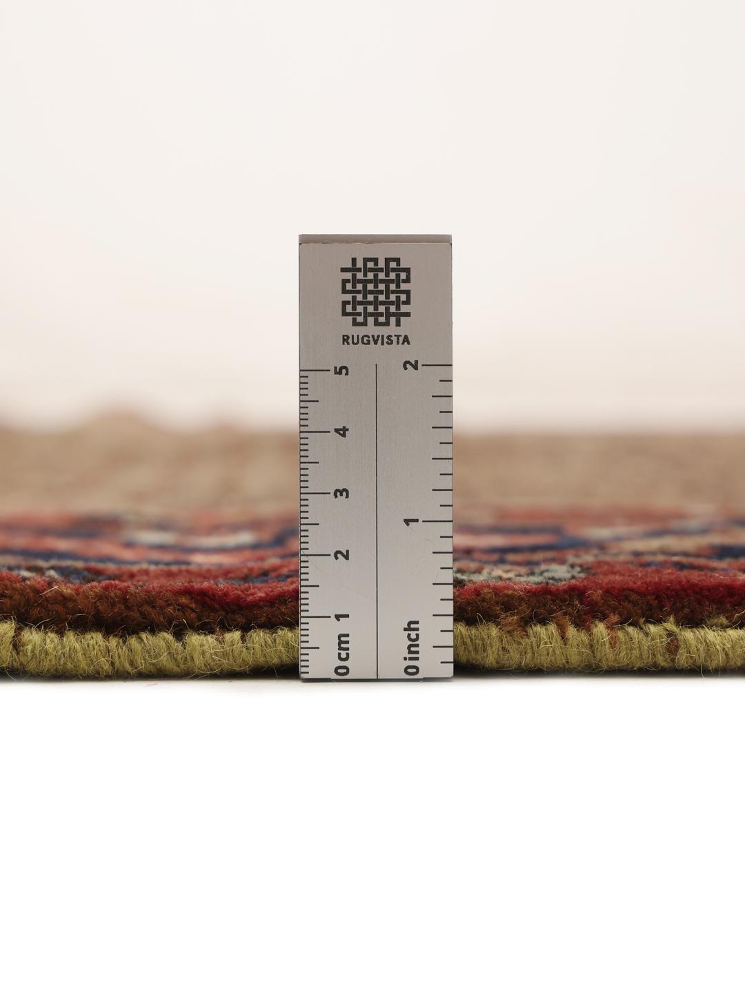 Koliai rug from the Middle East with a brown field and geometric medallion