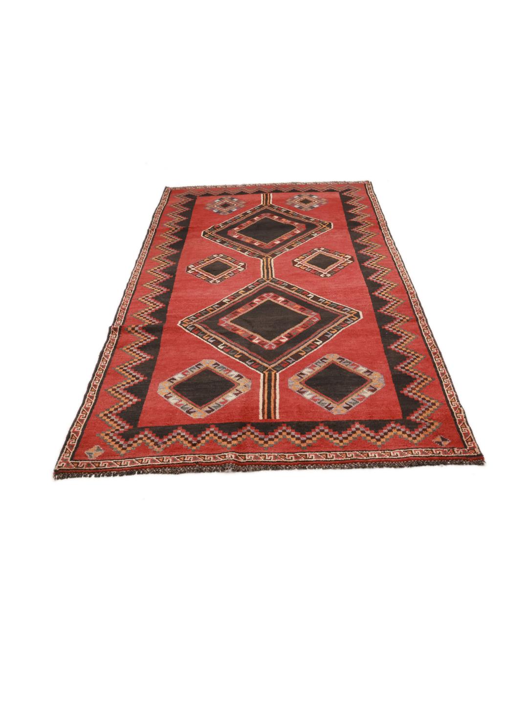 Hand-knotted Shiraz rug from the Middle East featuring geometric diamond patterns in red and black