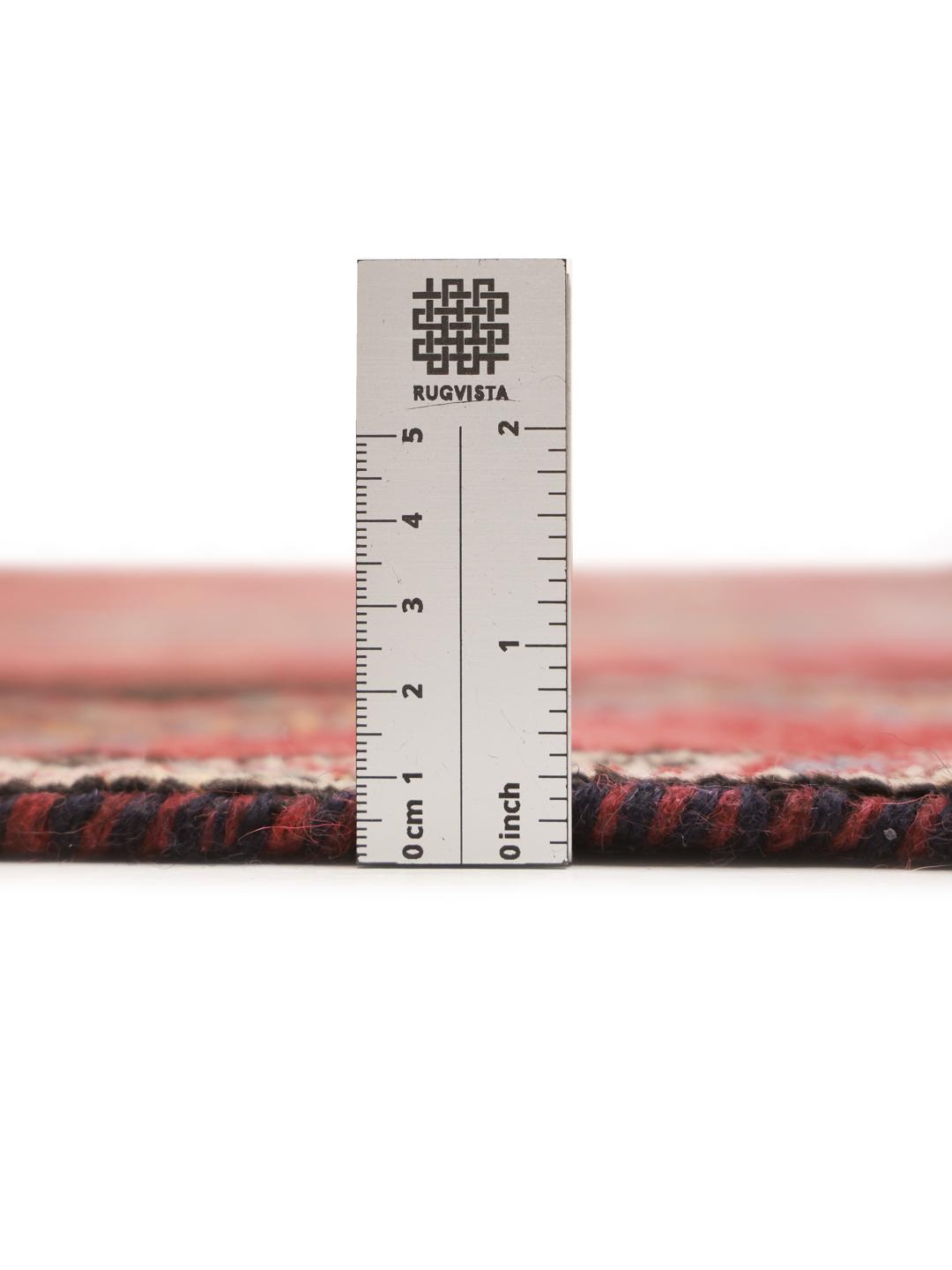Hand-knotted Shiraz rug from the Middle East featuring geometric diamond patterns in red and black