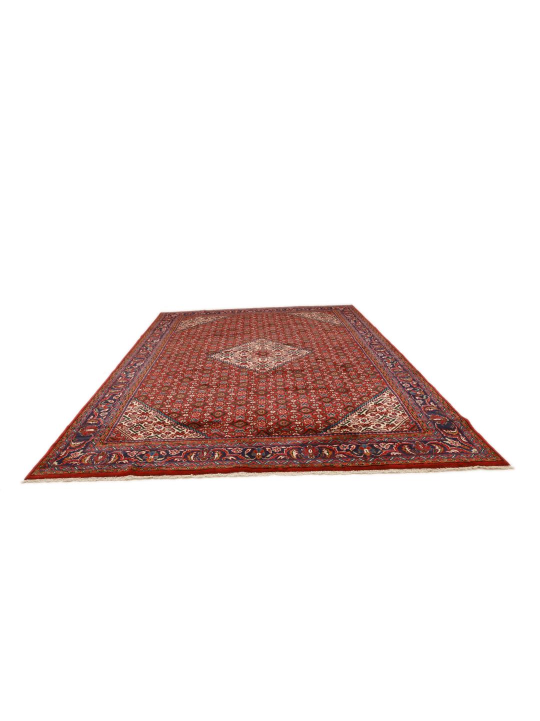 Hand-knotted Hosseinabad rug from the Middle East with a red field and decorative borders.