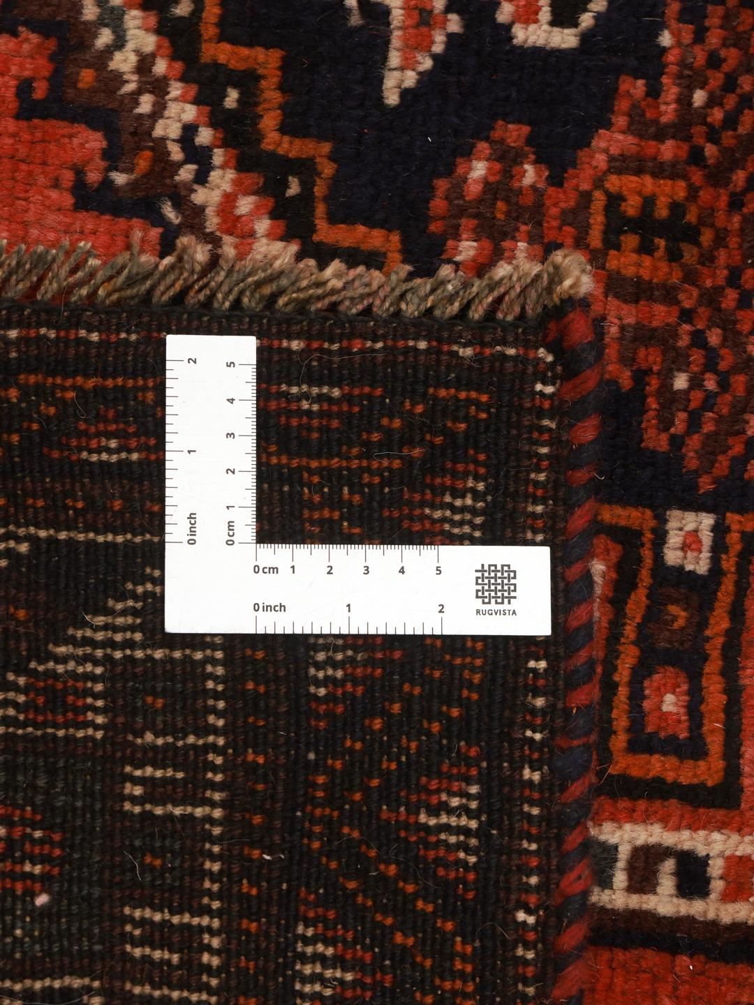 Håndknyttet Shiraz-tæppe fra Mellemøsten med en levende rød flade og geometriske motiver.