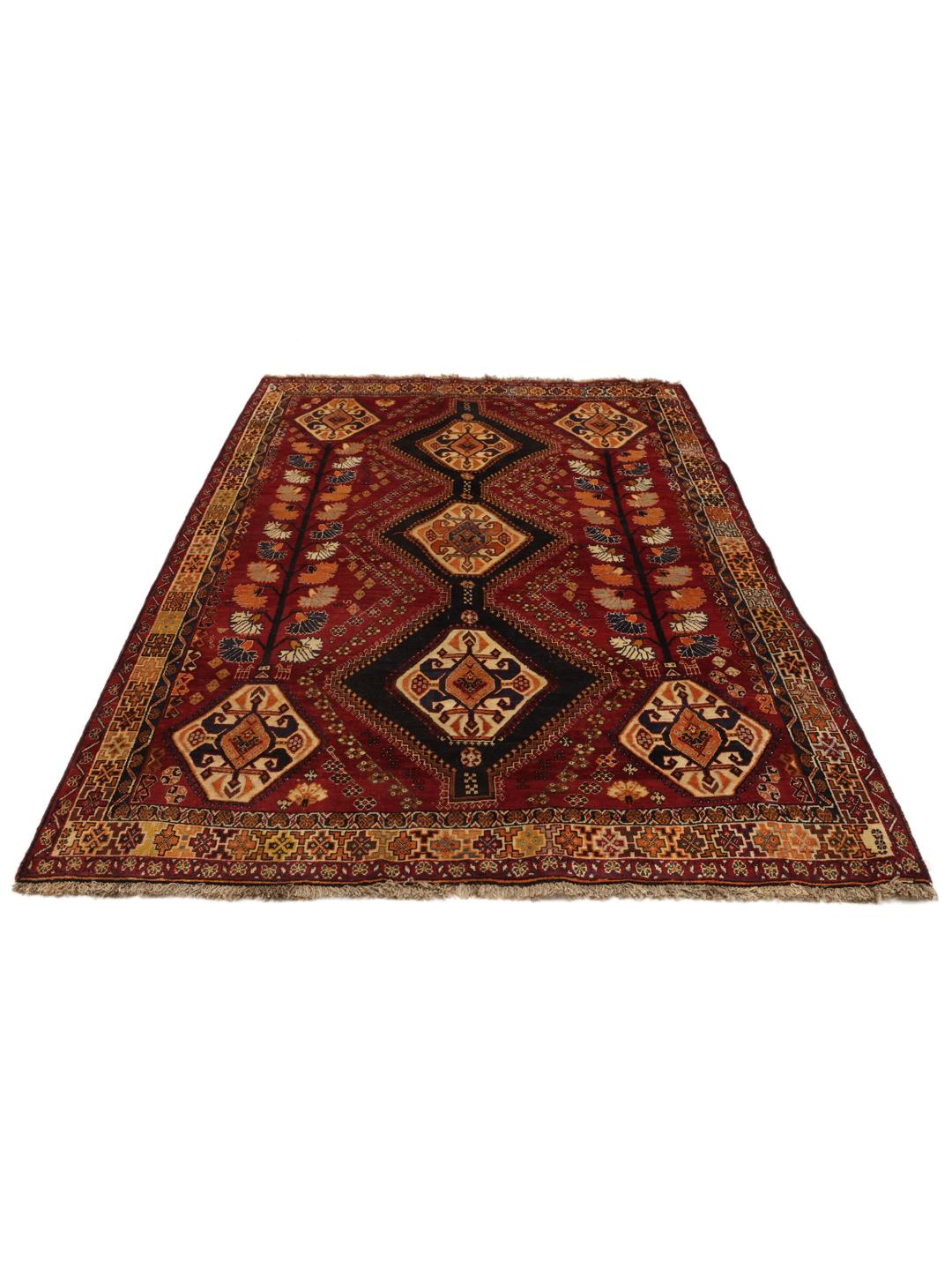 Hand-knotted red and dark-blue tribal rug from the Middle East