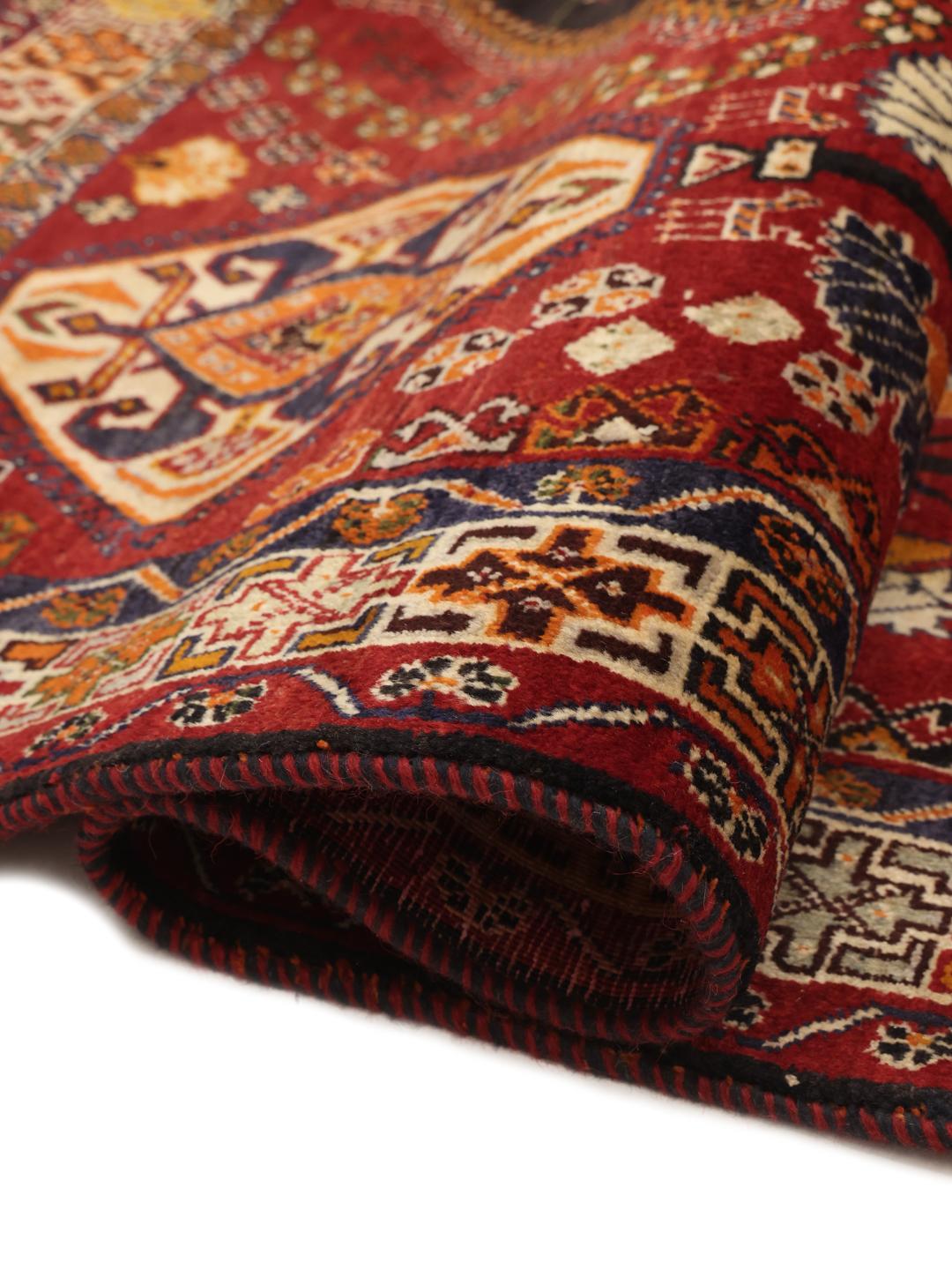 Hand-knotted red and dark-blue tribal rug from the Middle East