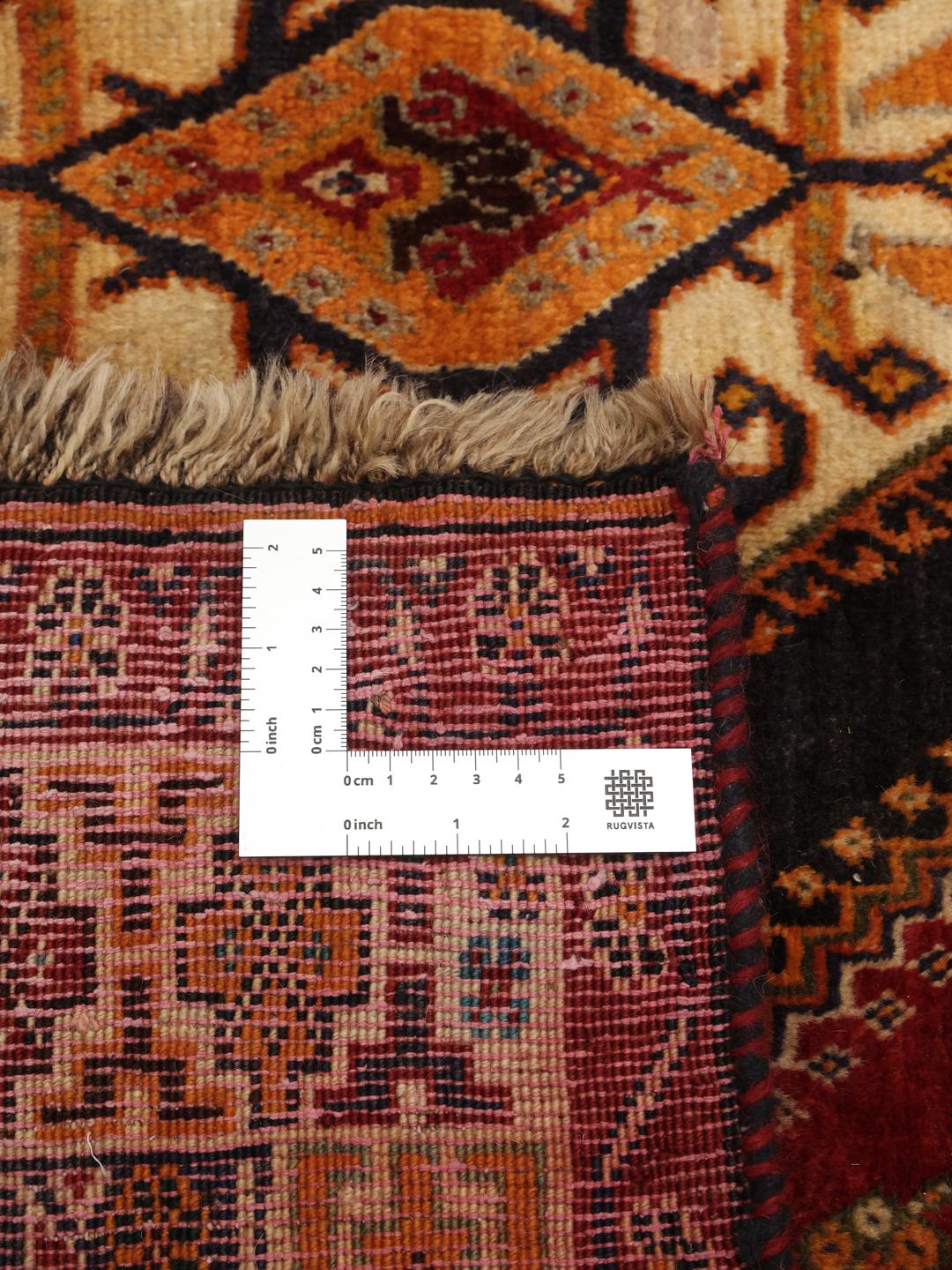 Hand-knotted red and dark-blue tribal rug from the Middle East
