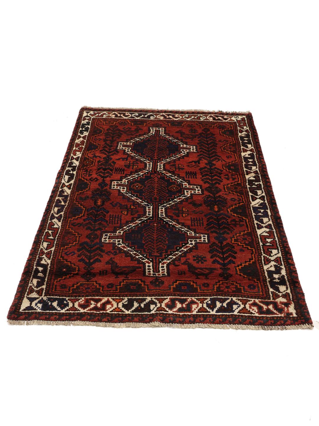 Hand-knotted Shiraz rug from the Middle East in deep red and blue tones
