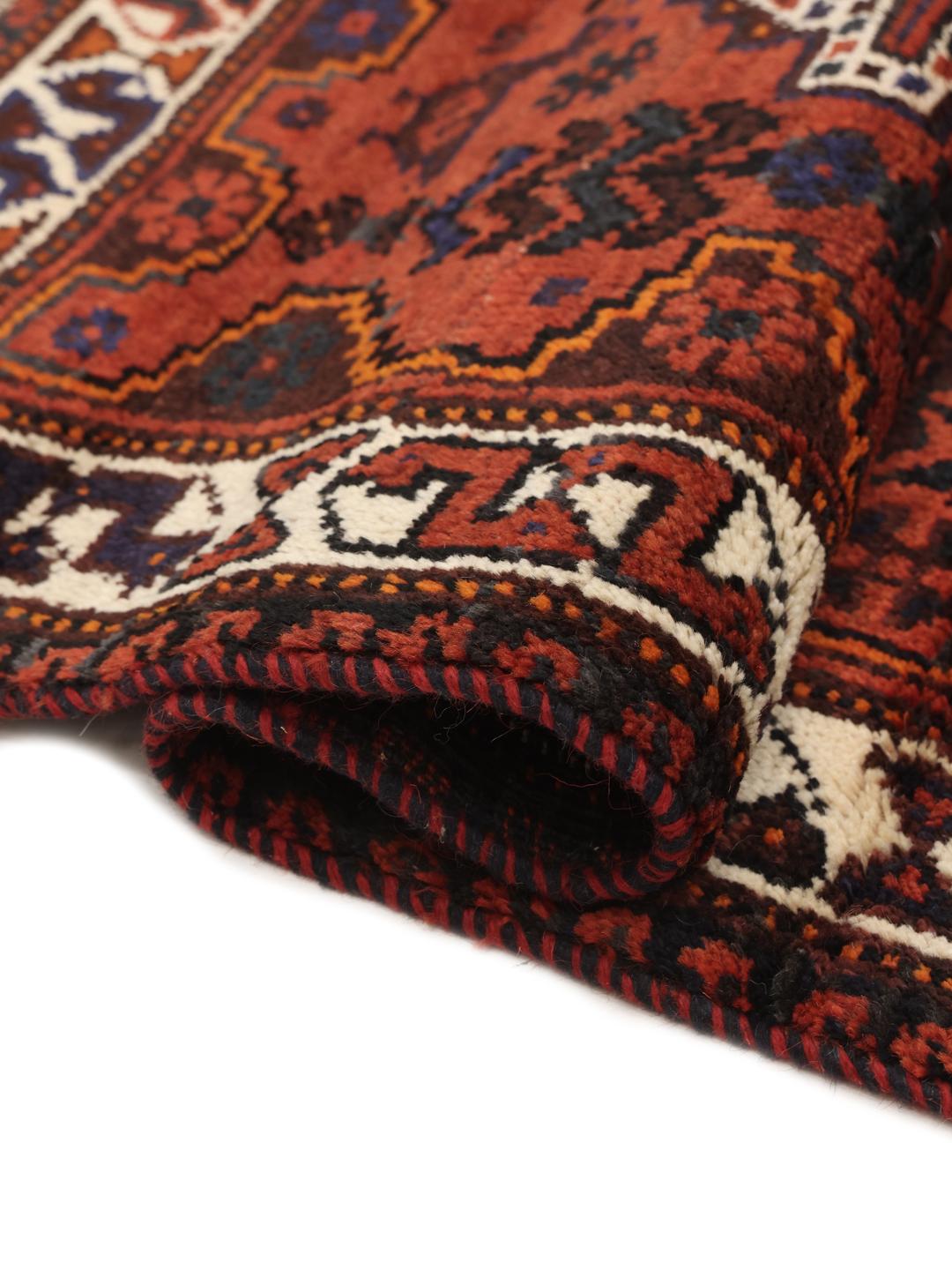 Hand-knotted Shiraz rug from the Middle East in deep red and blue tones