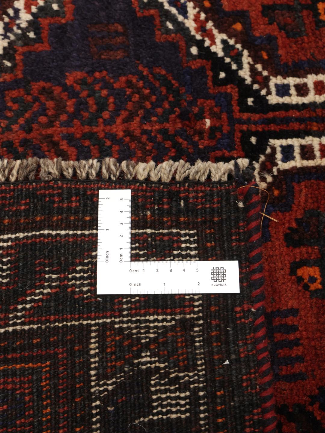 Hand-knotted Shiraz rug from the Middle East in deep red and blue tones