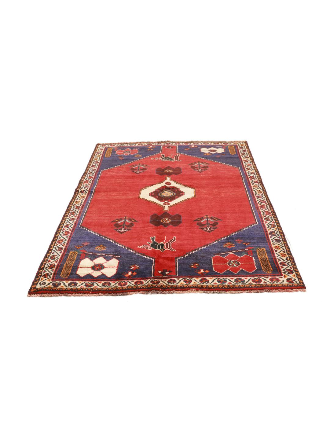 Hand-knotted Qashqai rug from the Middle East in red and deep blue tones