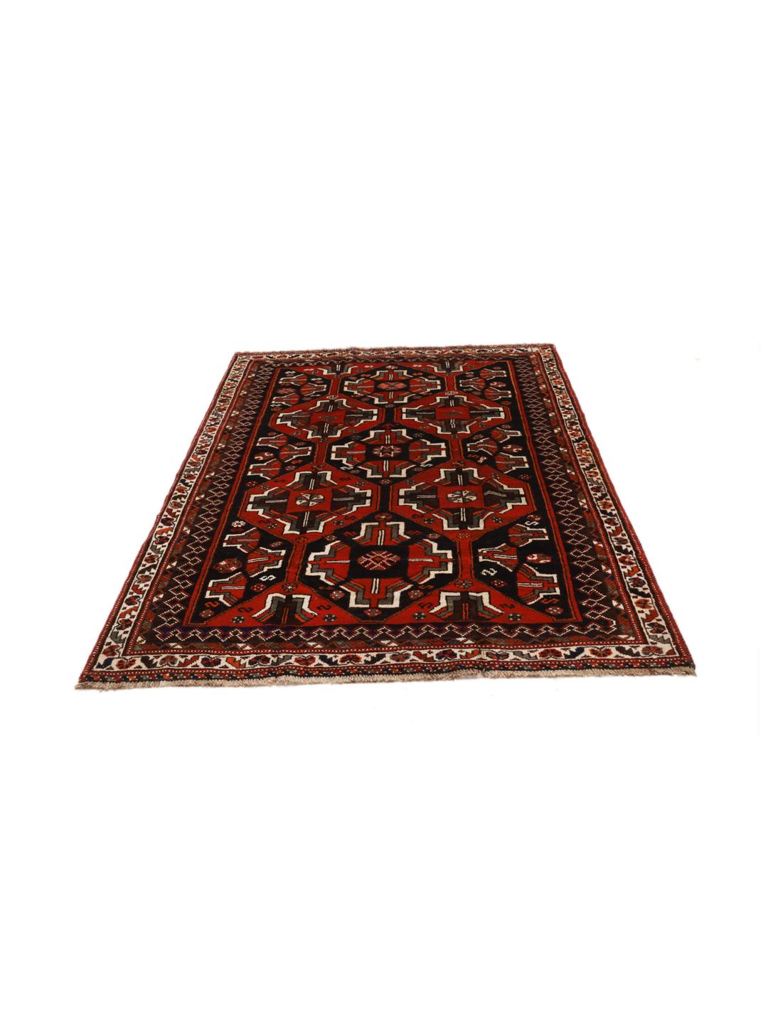 A hand-knotted Shiraz rug from the Middle East in deep red and black tones with geometric patterns.