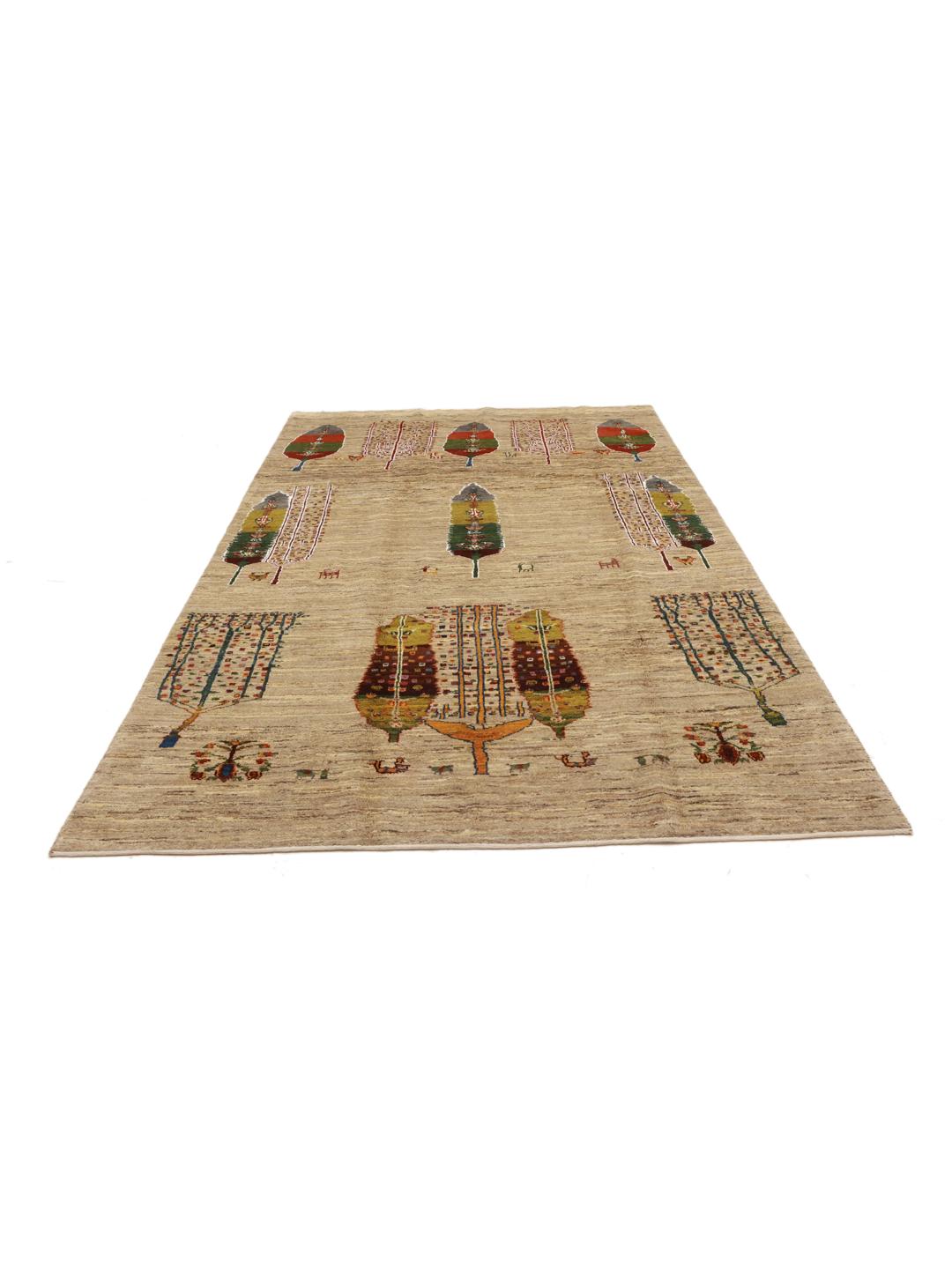 Hand-knotted Gabbeh rug from the Middle East featuring tree motifs in beige and multicolor wool.