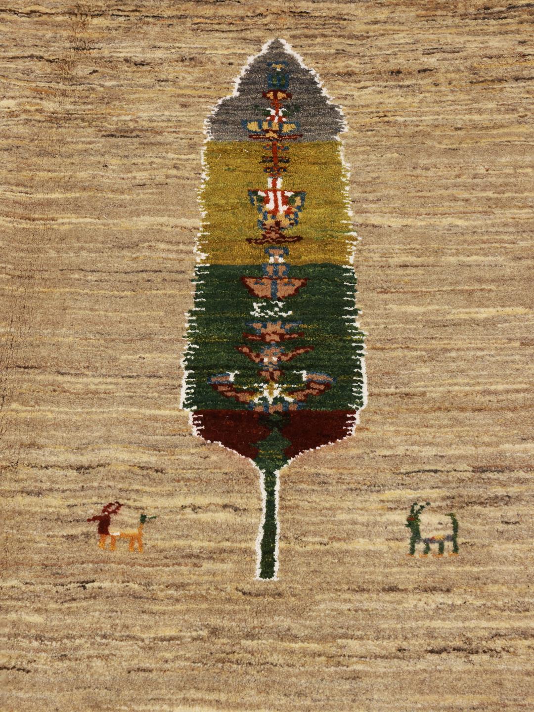 Hand-knotted Gabbeh rug from the Middle East featuring tree motifs in beige and multicolor wool.
