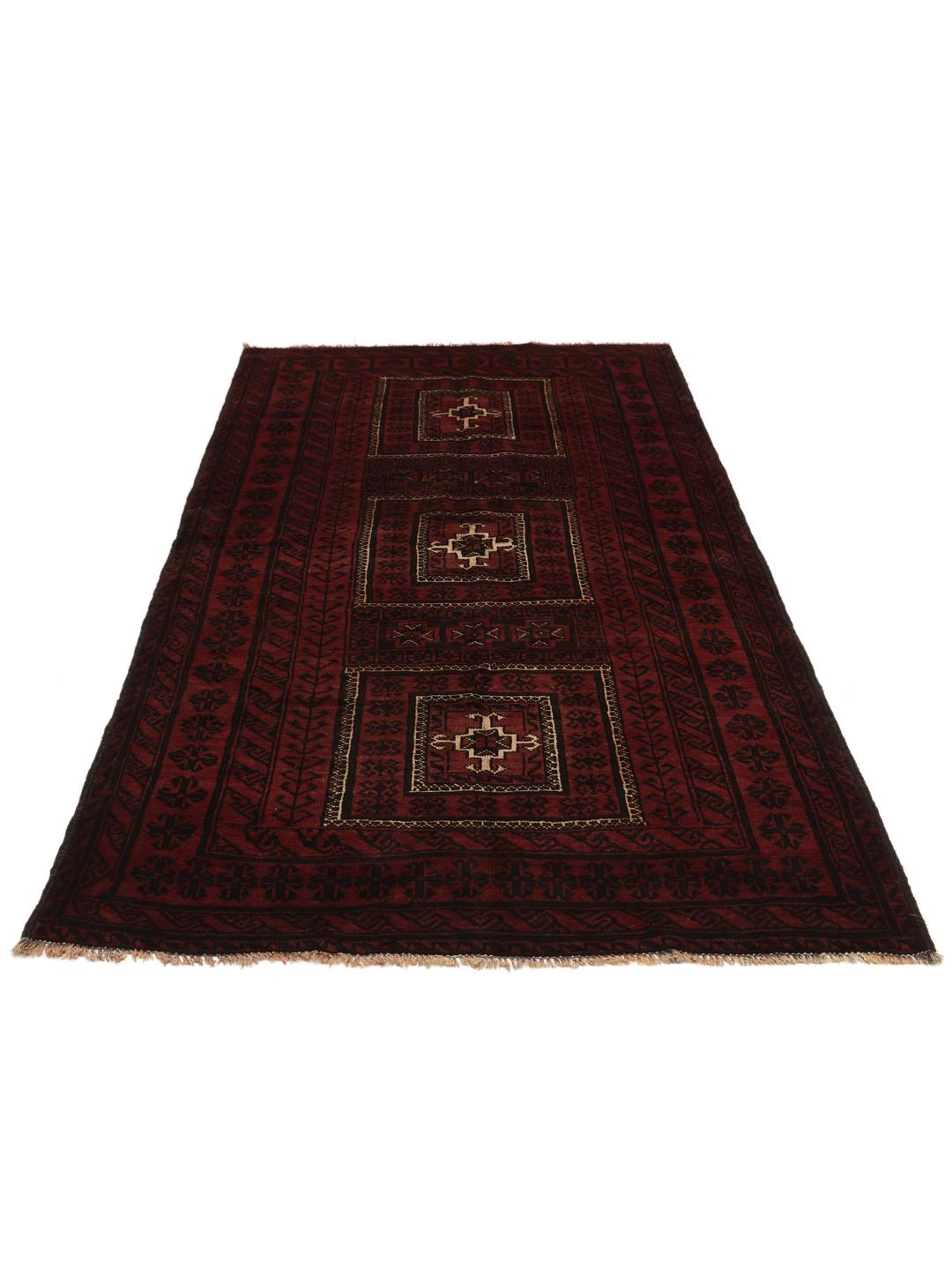 A hand-knotted Middle Eastern Beluch rug in deep red and black tones with geometric patterns.
