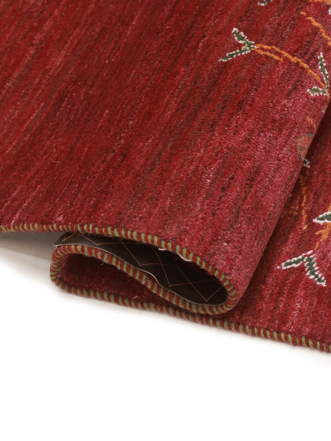 Hand-knotted Gabbeh rug from the Middle East with a red field and a tree of life design