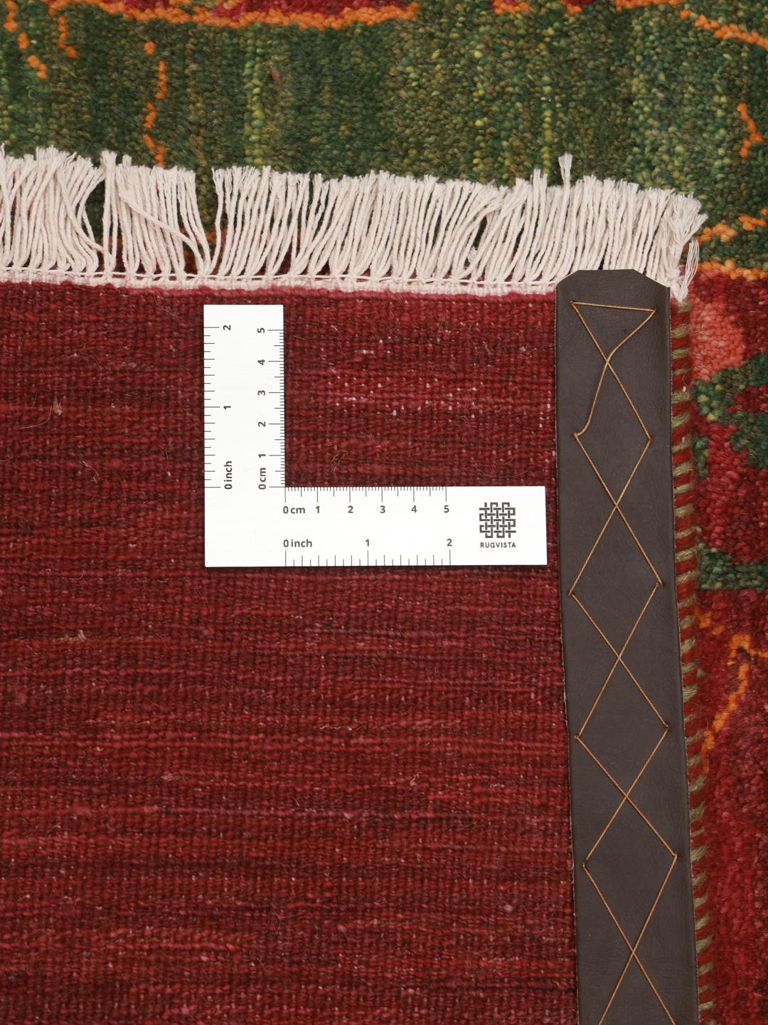 Hand-knotted Gabbeh rug from the Middle East with a red field and a tree of life design