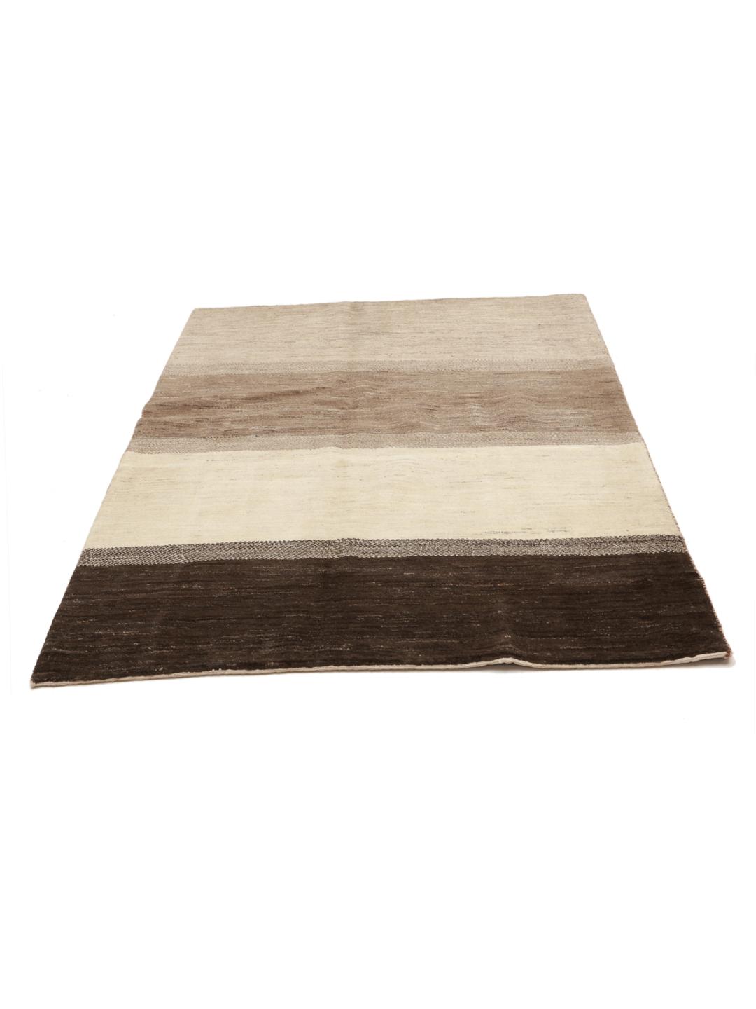 A hand-knotted Gabbeh rug from the Middle East featuring striped earthy brown and beige tones.